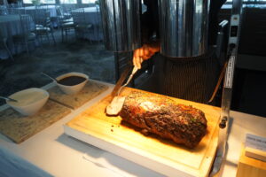 chef cutting up a slab of meat